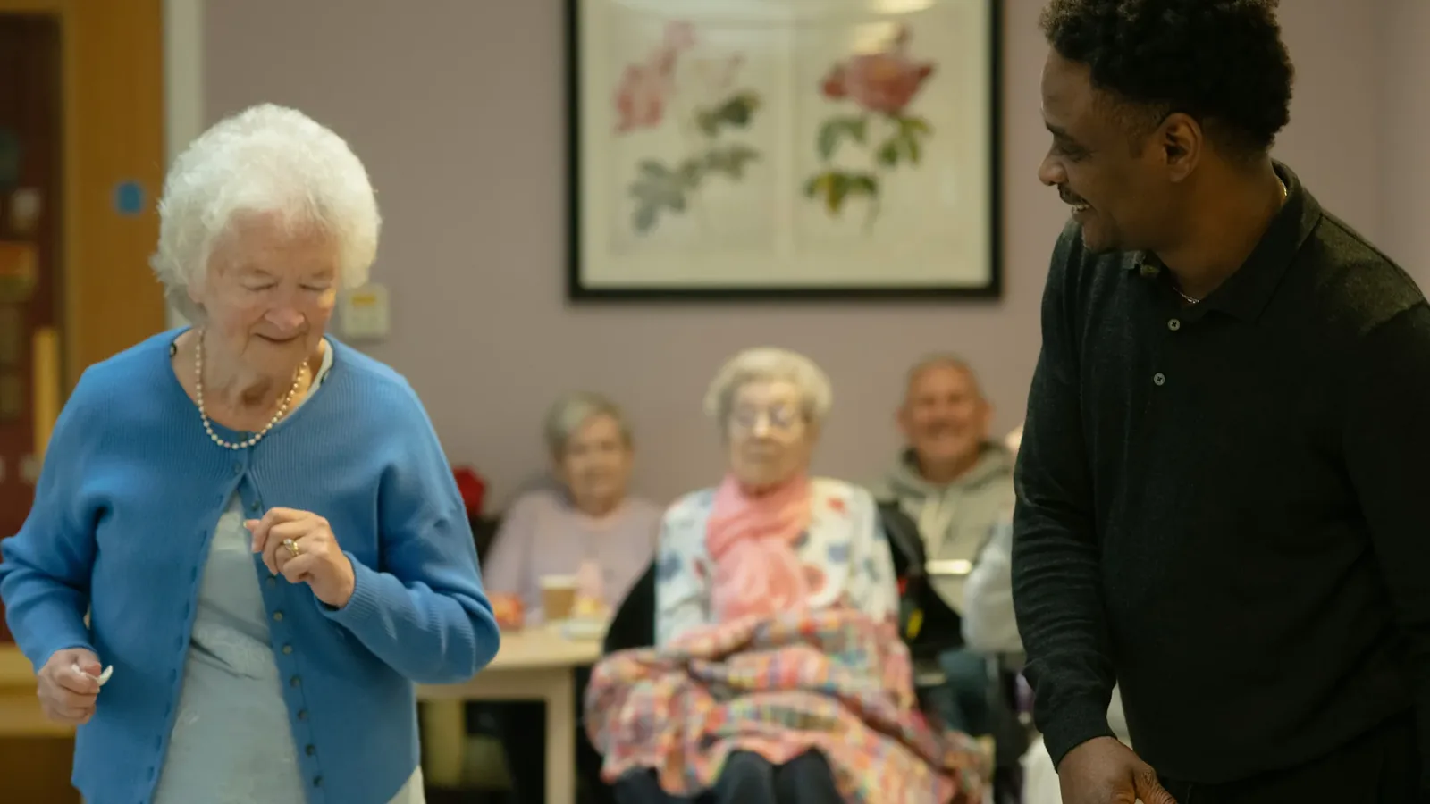 A lively music session filling a bright aged-care lounge