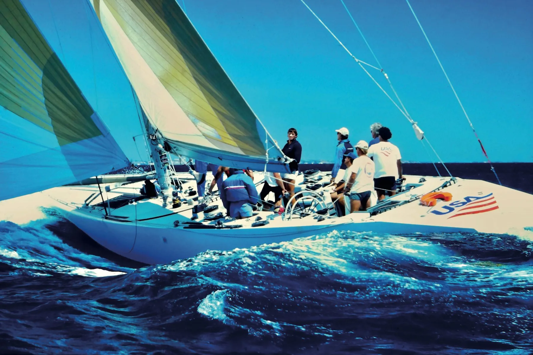 Crew aboard USA (US-61) in rough water during the 1986–87 America's Cup challenger series off Fremantle